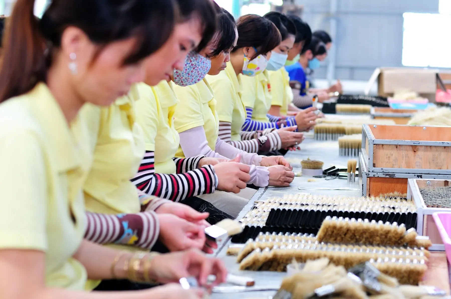 Workers on a production line in an Asian factory