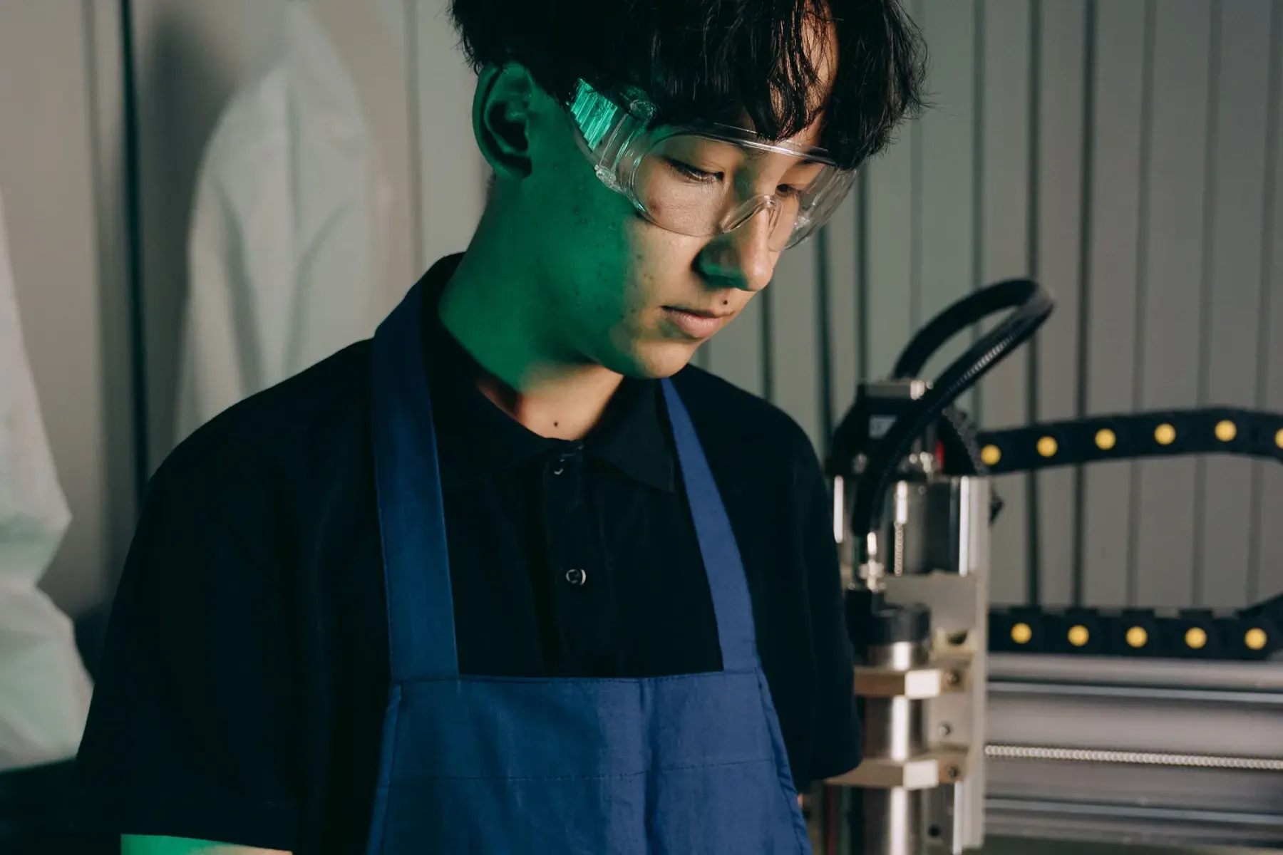 A technician checking a device in a workshop